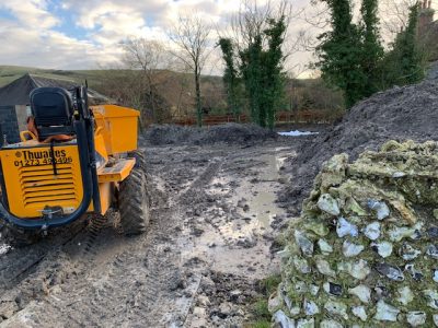  moving soil around in the working top garden