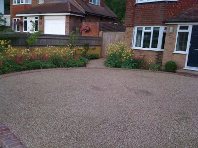  The front garden and sweeping new drive edged by generous planting 