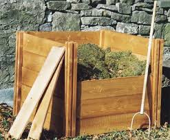 Adding boards to front of wooden compost bin