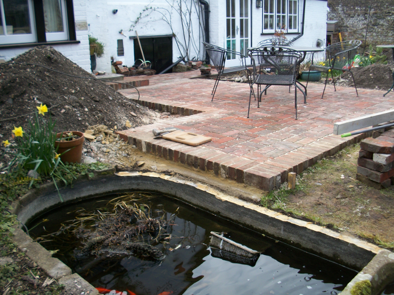 The new brick terrace is nearly complete, the existing pool is ready for it's new edging course, pump and filter.