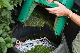 Adding shredded paper and grass clippings