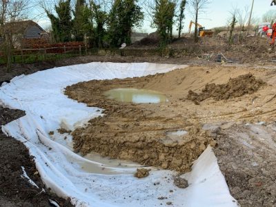  puddling clay spread over the pond surface.